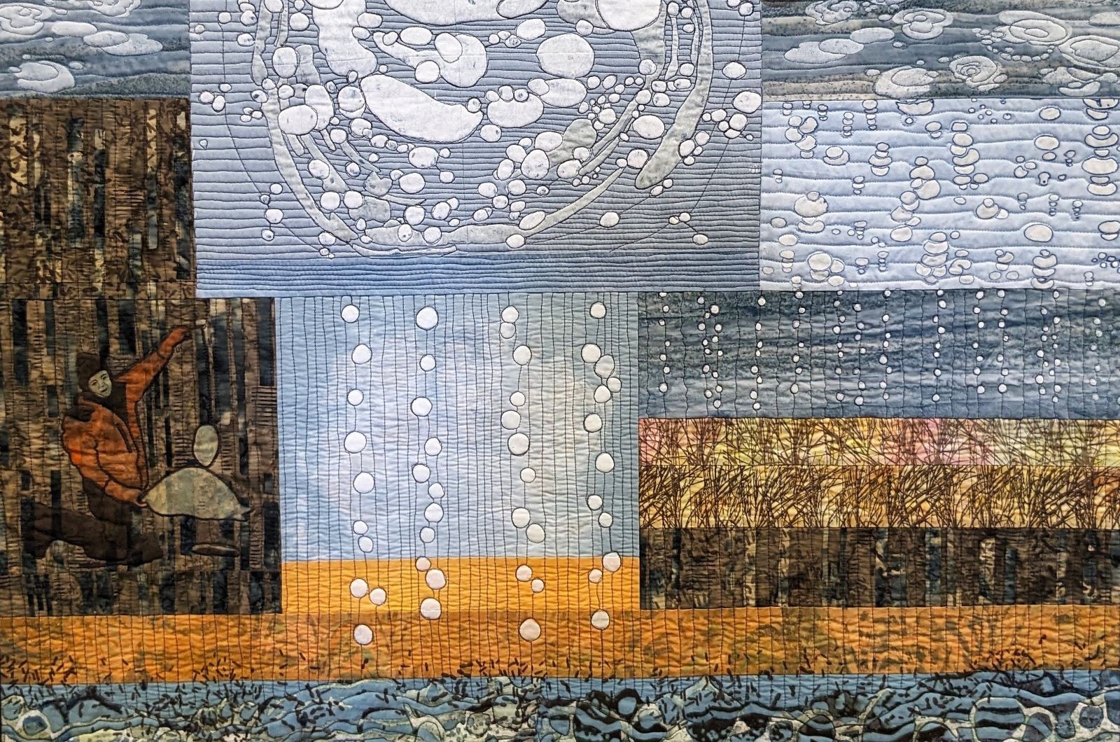 Quilted art piece by Ree Nancarrow, representing the vulnerability of boreal lowland complexes to methane emissions and wildfire disturbances