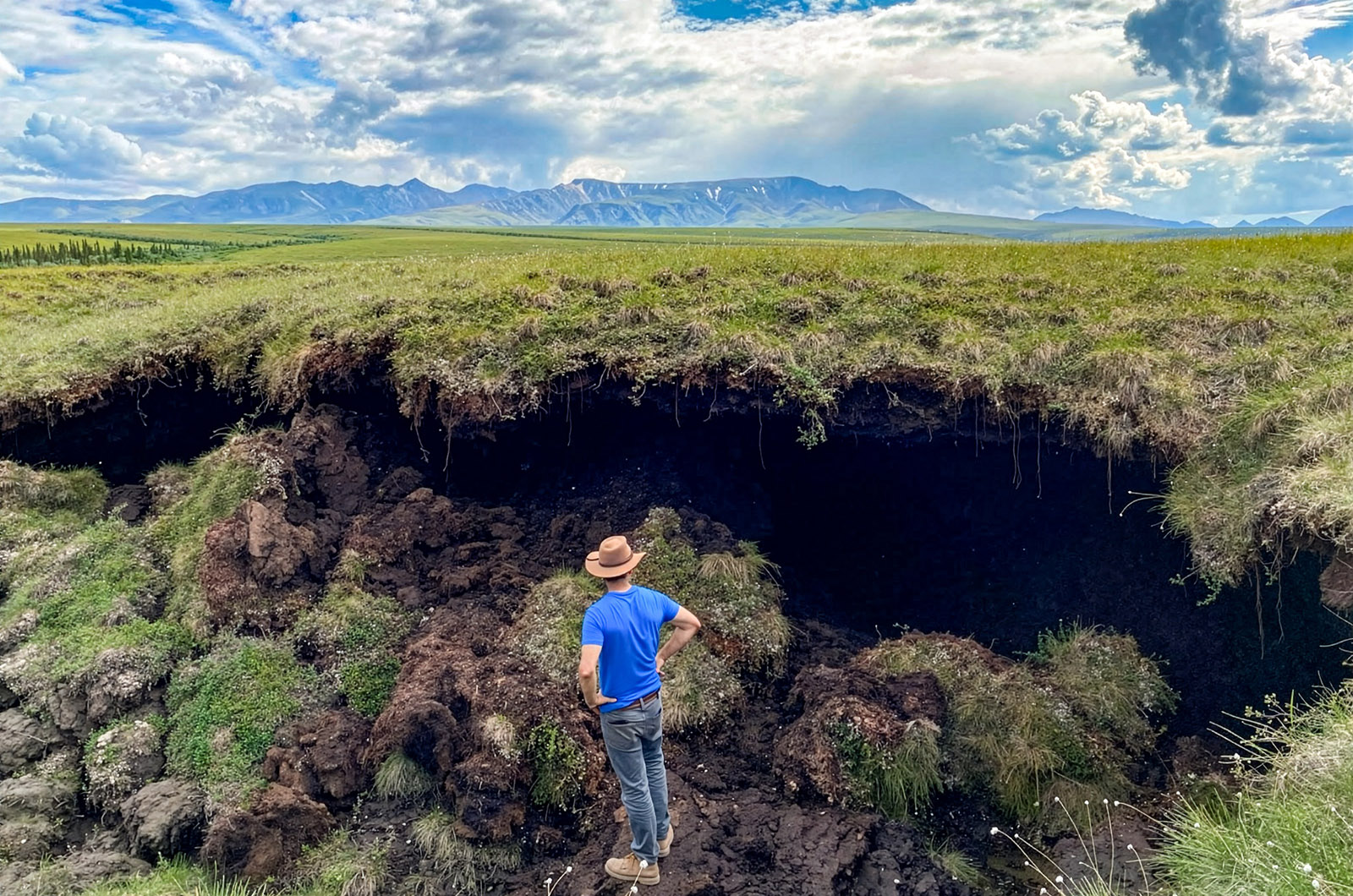 Examining a thermokarst feature in Denali National Park and Preserve.  Photo: E. Lathrop