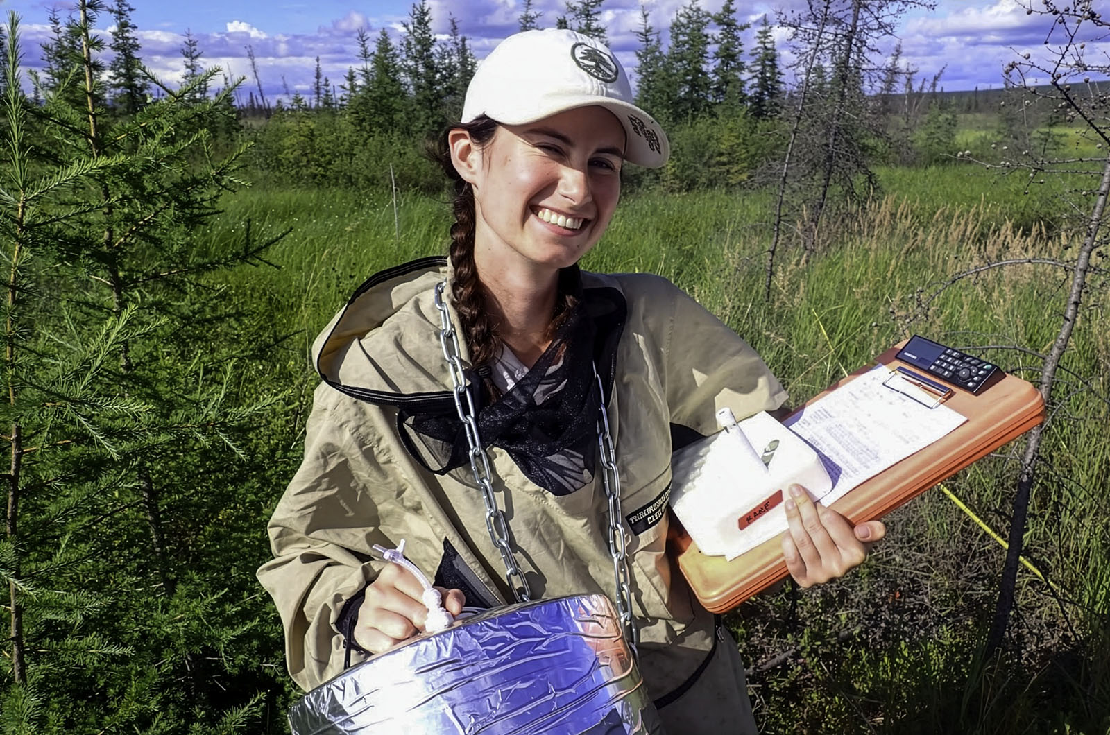 Collecting greenhouse gas samples in a permafrost-affected fen ecosystem.  Photo: C. Dieleman